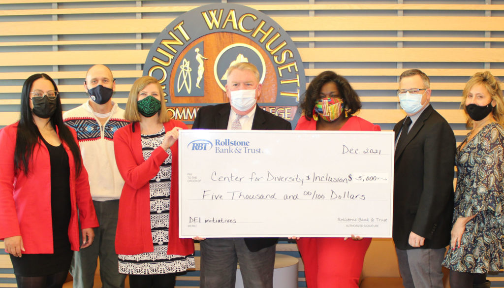 picture of people holding ceremonial check