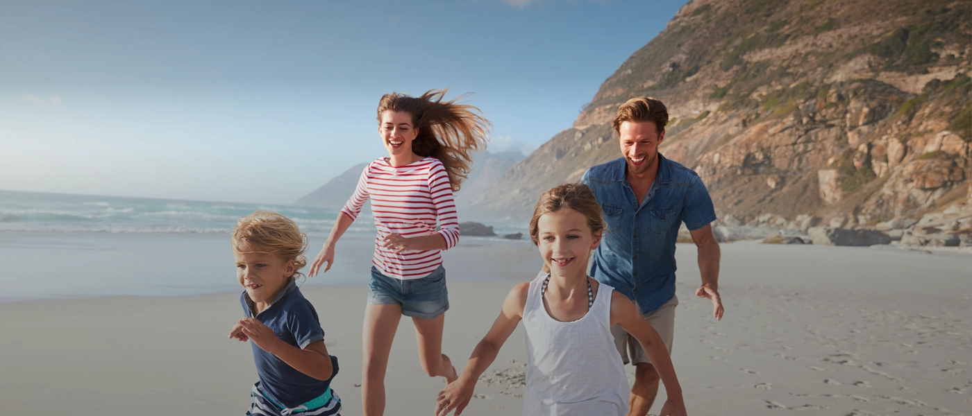 CreditDebitNEW-3 Family running on beach